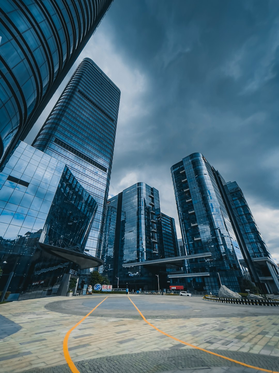 a-group-of-tall-buildings-sitting-next-to-each-other-3-dkzkg-ybo